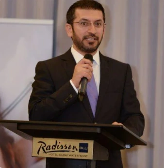 Dr. Mohammad Najafi speaking at a professional event